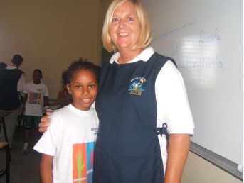 Suzie with a child from the Kids Connect Summer Camp