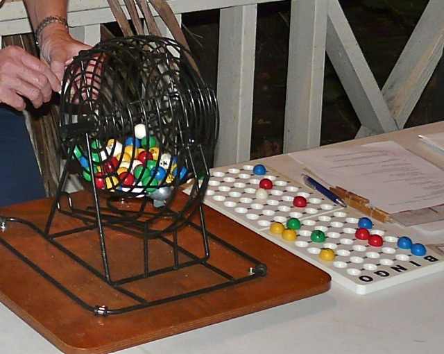 AARF uses real Bingo equipment. Shown here is the wheel that mixes the balls and spits on out. Next to it is a tray to hold the balls (and is used to verify that a winner's card is valid)